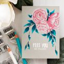 It’s STAMPtember! | Studio Katia Exclusive – Blooming Trio card by Yana Smakula. Polychromos pencils colored peonies.