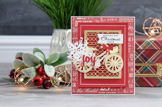 Spellbinders | Layered Dimensional Die Cutting. Episode #4 – Christmas Bicycle Card by Yana Smakula using S2-266 Ho Ho Ho, S3-272 Build a Stocking, S3-282 Bicycle, S4-793 Gossamer Knot Ensemble, S4-822 Deck the Halls, S5-308 Hemstitch Rectangles Dies #spellbinders #diecutting #christmascard #handmadecard