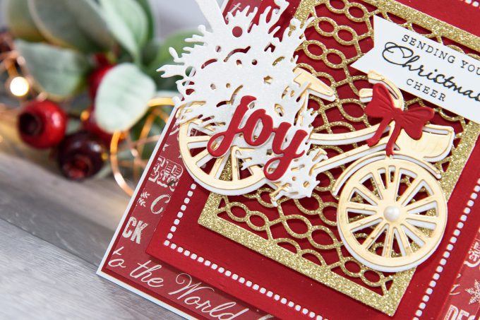 Spellbinders | Layered Dimensional Die Cutting. Episode #4 – Christmas Bicycle Card by Yana Smakula using S2-266 Ho Ho Ho, S3-272 Build a Stocking, S3-282 Bicycle, S4-793 Gossamer Knot Ensemble, S4-822 Deck the Halls, S5-308 Hemstitch Rectangles Dies #spellbinders #diecutting #christmascard #handmadecard