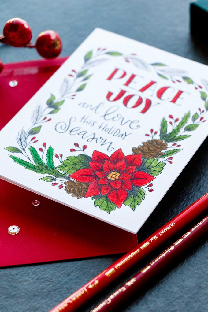 Simon Says Stamp | Polychromos Pencil Colored Suzy's Watercolor Print - Peace & Joy Card. Project by Yana Smakula #cardmaking #simonsaysstamp #christmascard #pencilcoloring