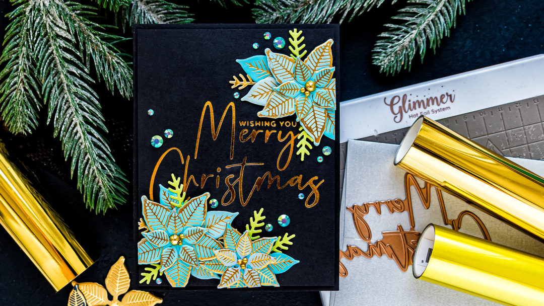 Spellbinders | Foiled Merry Christmas card by Yana Smakula featuring GLP-204 Stylish Script Merry Christmas and GLP-196 Glimmer Poinsettia Glimmer Hot Foil #Spellbinders #NeverStopMaking #Christmascard #GlimmerHotFoilSystem